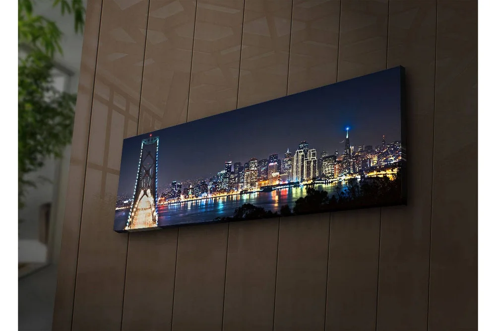 Lerretsbilde med LED-belysning 30x90 cm - Nattlig bybilde med bro og silhuetter av skyskrapere v:4941821